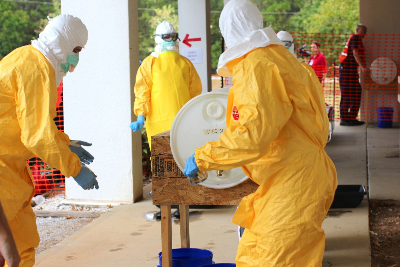 Professional restoration technicians in Norwalk wearing PPE for biohazard cleanup service