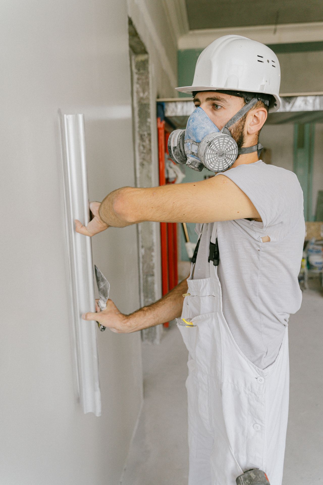 Professional restoration service team member fixing property in Greenwich